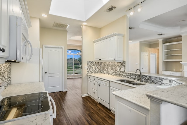 kitchen featuring white appliances, decorative backsplash, dark hardwood / wood-style flooring, white cabinets, and sink