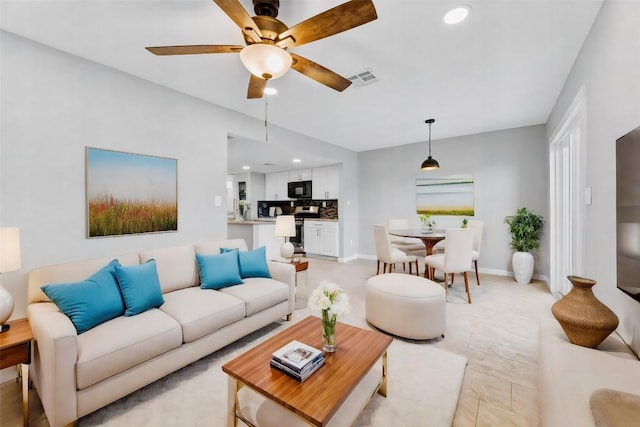 living room with ceiling fan, recessed lighting, visible vents, and baseboards