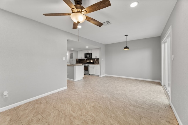 unfurnished living room featuring light tile patterned floors and ceiling fan