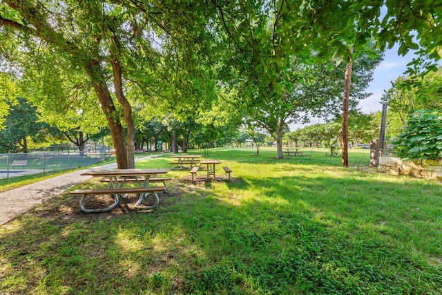 view of home's community featuring a lawn