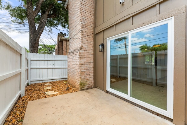 view of patio / terrace featuring fence