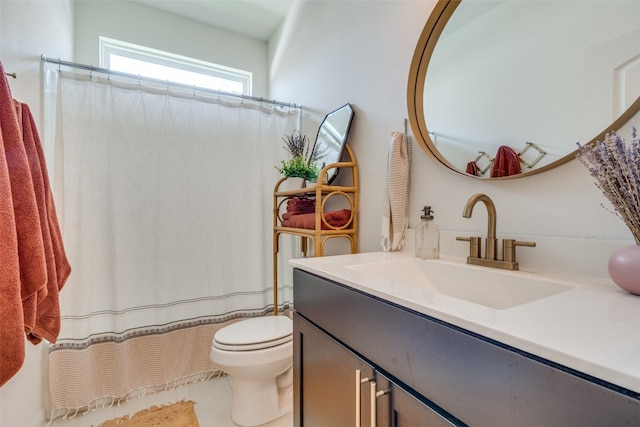 bathroom with tile patterned floors, vanity, and toilet