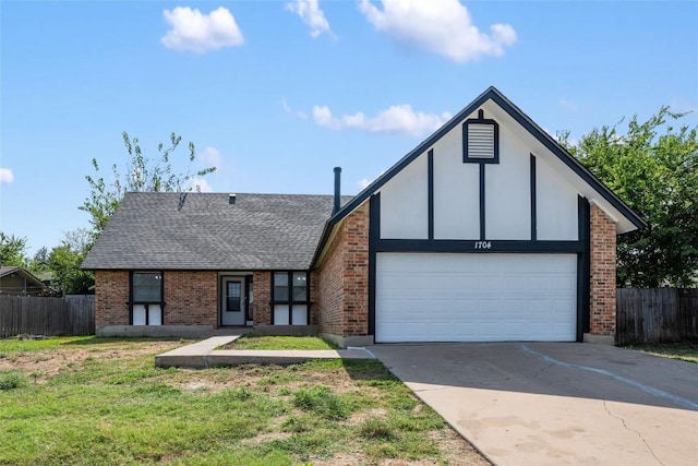 view of front of property with a front yard and a garage