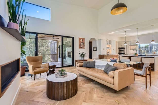 107 Blue Ridge Trl, Austin, TX 78746 - living room featuring a high ceiling and arched walkways