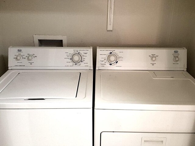 washroom featuring washer and dryer