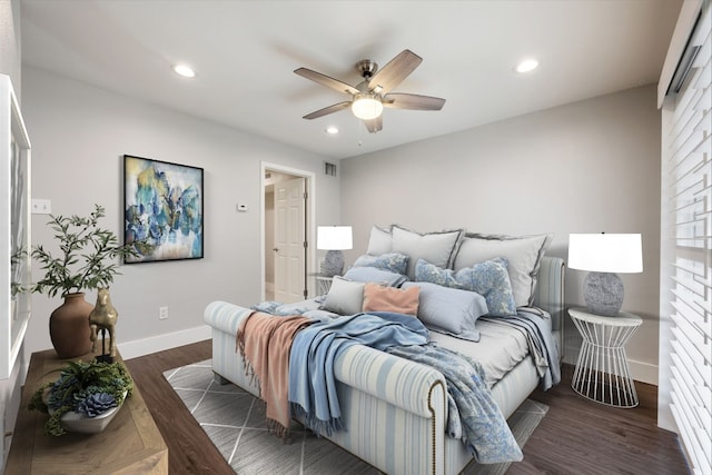 bedroom featuring ceiling fan and dark hardwood / wood-style floors