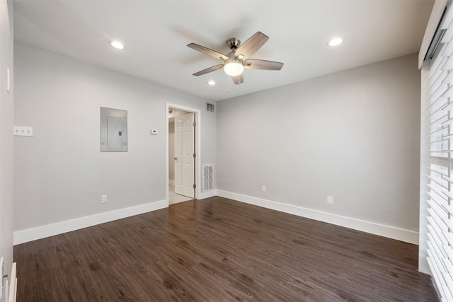 unfurnished bedroom featuring electric panel, dark hardwood / wood-style flooring, and ceiling fan