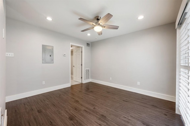 935 La Posada Dr Unit 115, Austin, TX 78752 - unfurnished bedroom featuring electric panel, baseboards, dark wood-type flooring, recessed lighting, and ceiling fan