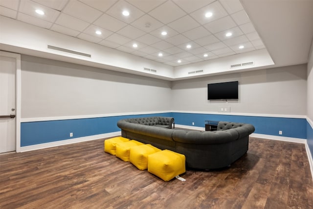 interior space featuring a drop ceiling and wood-type flooring