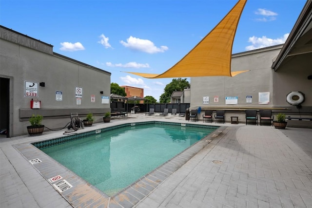 935 La Posada Dr Unit 115, Austin, TX 78752 - community pool featuring a patio