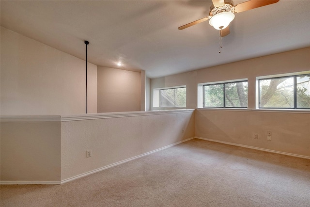 carpeted empty room with ceiling fan