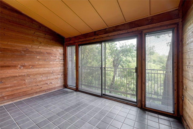 unfurnished sunroom with lofted ceiling