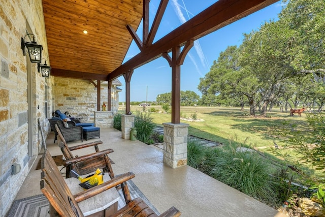 view of patio featuring a porch