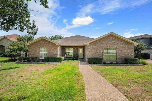 single story home featuring a front yard