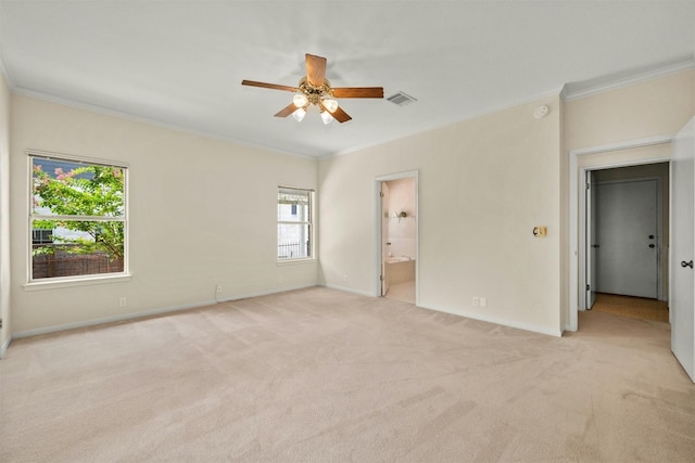 unfurnished bedroom with ceiling fan, light colored carpet, ornamental molding, and connected bathroom