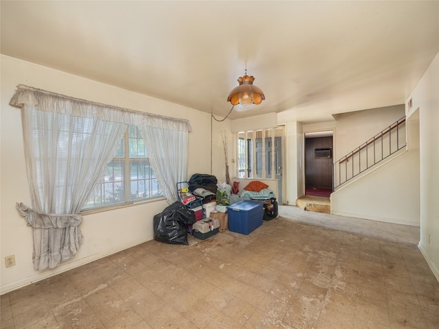 interior space with a wall mounted AC and tile patterned floors