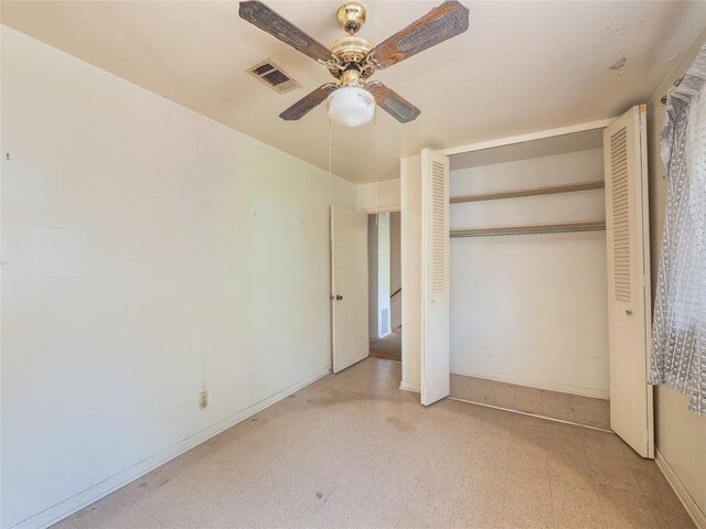 unfurnished bedroom featuring ceiling fan, light tile patterned floors, and a closet