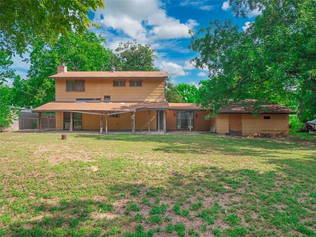 403AND401 Ramble Ln, Austin, TX 78745 - back of house featuring a chimney and a patio area