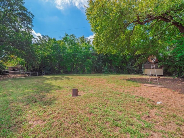 403AND401 Ramble Ln, Austin, TX 78745 - view of green lawn featuring a trampoline