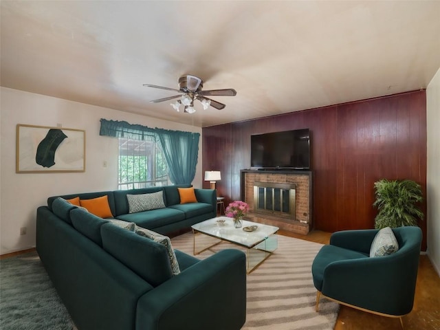 403AND401 Ramble Ln, Austin, TX 78745 - living room featuring ceiling fan, a brick fireplace, and wooden walls