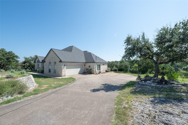 view of property exterior featuring a garage