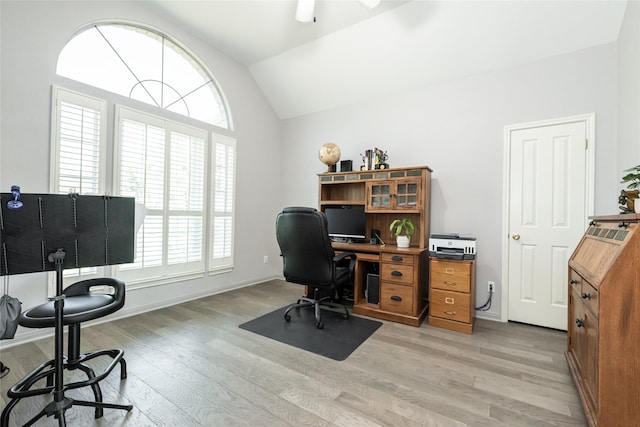 office area featuring light hardwood / wood-style flooring and lofted ceiling