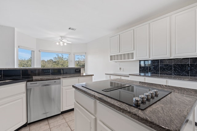 kitchen featuring stainless steel dishwasher, white cabinetry, black electric stovetop, ceiling fan, and light tile patterned floors