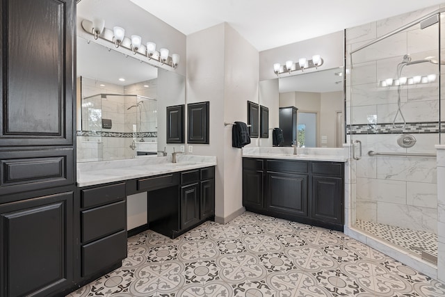 bathroom with a shower with shower door, tile patterned floors, and vanity