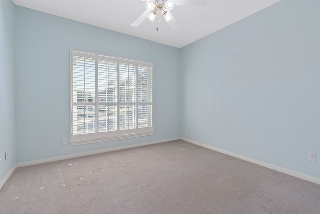 empty room featuring carpet flooring and ceiling fan