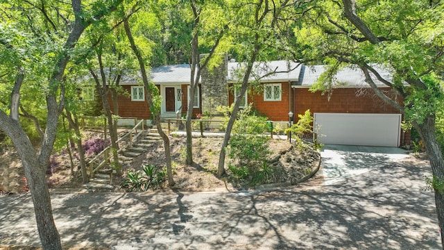 single story home with a garage