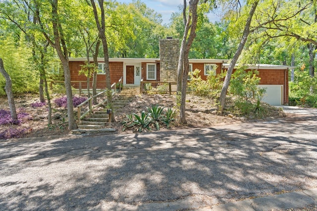 single story home featuring a garage