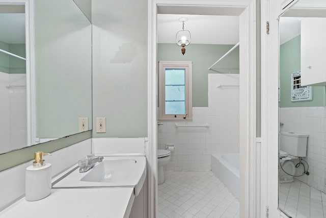 full bathroom featuring tile walls, vanity, toilet, and tile patterned flooring