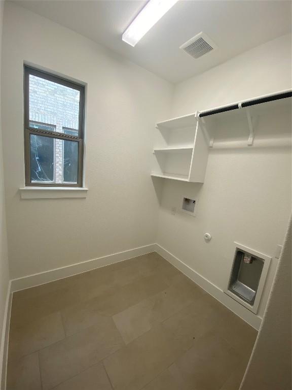 washroom featuring hookup for a washing machine and gas dryer hookup