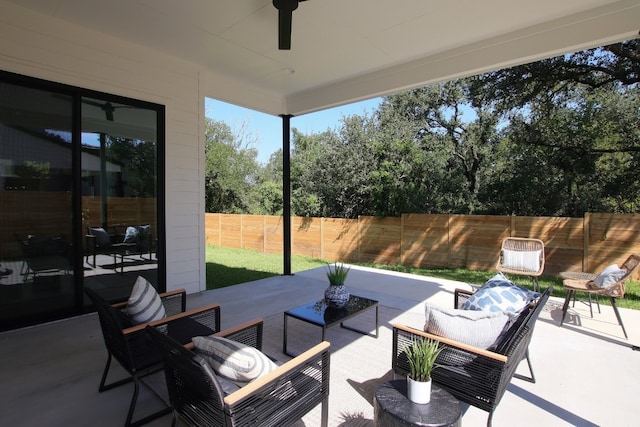 view of patio featuring an outdoor living space and ceiling fan