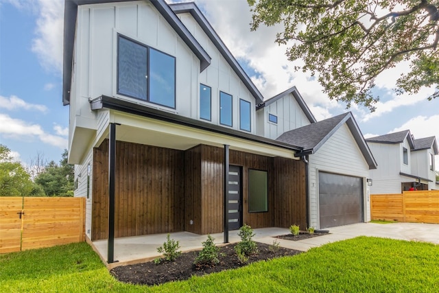 view of front of house with a front yard and a garage