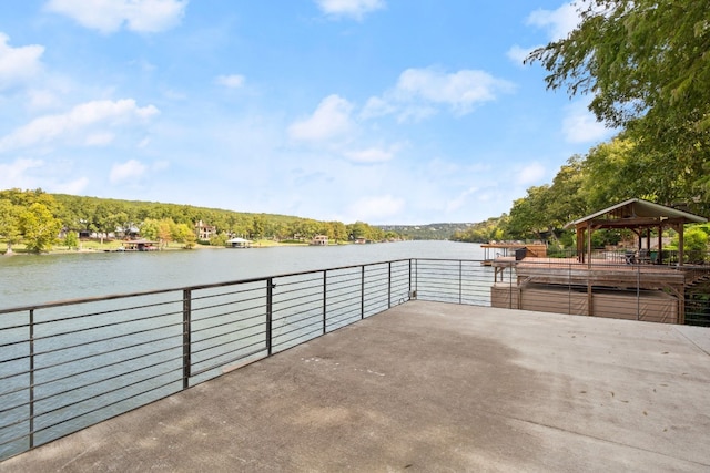 view of patio / terrace featuring a water view and a gazebo