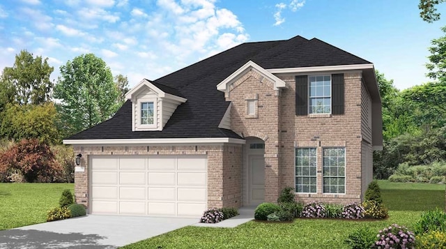 view of front of property featuring a garage and a front yard