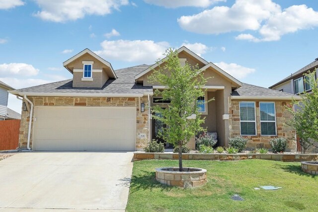 view of front of property with a front lawn and a garage