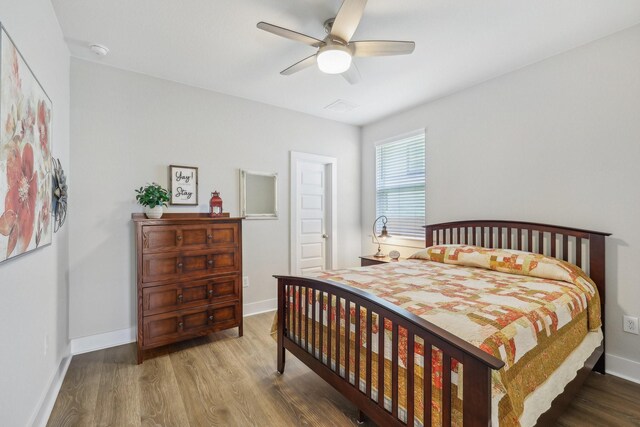 bedroom featuring ceiling fan and hardwood / wood-style floors