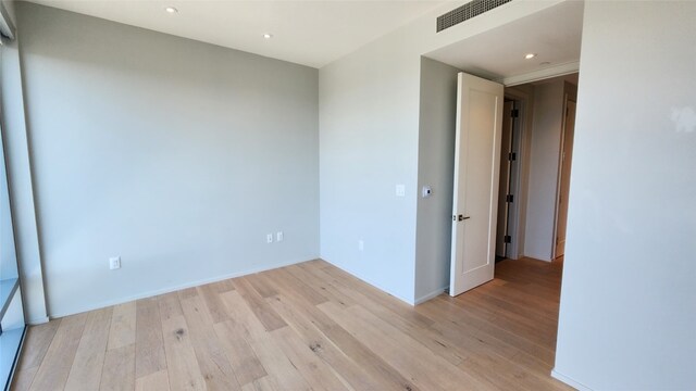 spare room featuring light hardwood / wood-style floors