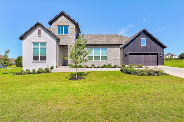 view of front of house featuring a front yard and a garage