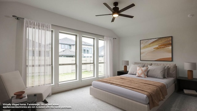 bedroom featuring lofted ceiling, carpet flooring, and ceiling fan