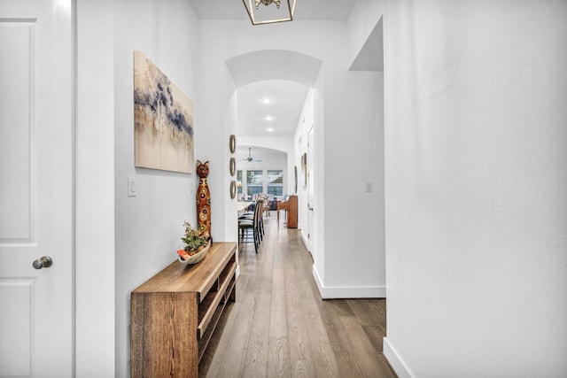 corridor with wood-type flooring