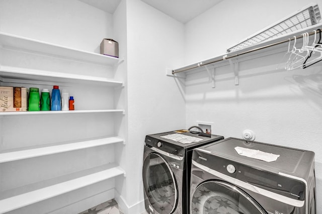 laundry area with washer and clothes dryer