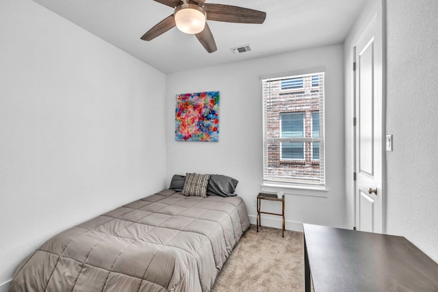 carpeted bedroom featuring ceiling fan