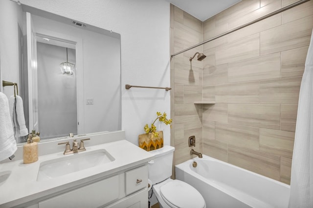 full bathroom featuring shower / bath combo with shower curtain, vanity, and toilet