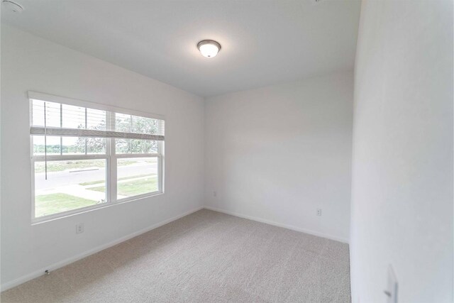 unfurnished room with carpet floors