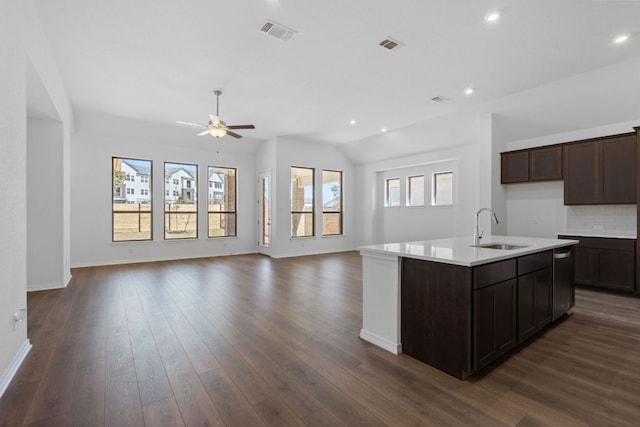 520 Raleigh Dr, Georgetown, TX 78633 - kitchen featuring open floor plan, ceiling fan, dark brown cabinetry, recessed lighting, and vaulted ceiling