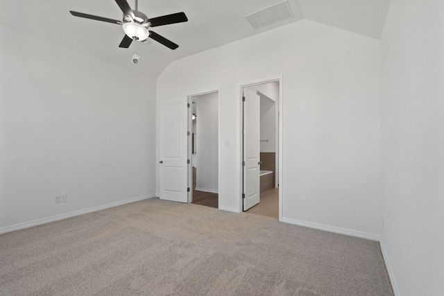 520 Raleigh Dr, Georgetown, TX 78633 - unfurnished bedroom with carpet flooring, vaulted ceiling, a ceiling fan, and connected bathroom