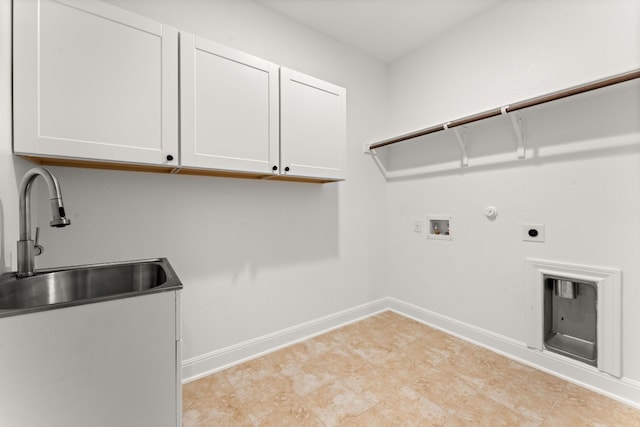 washroom featuring sink, cabinets, washer hookup, hookup for an electric dryer, and gas dryer hookup